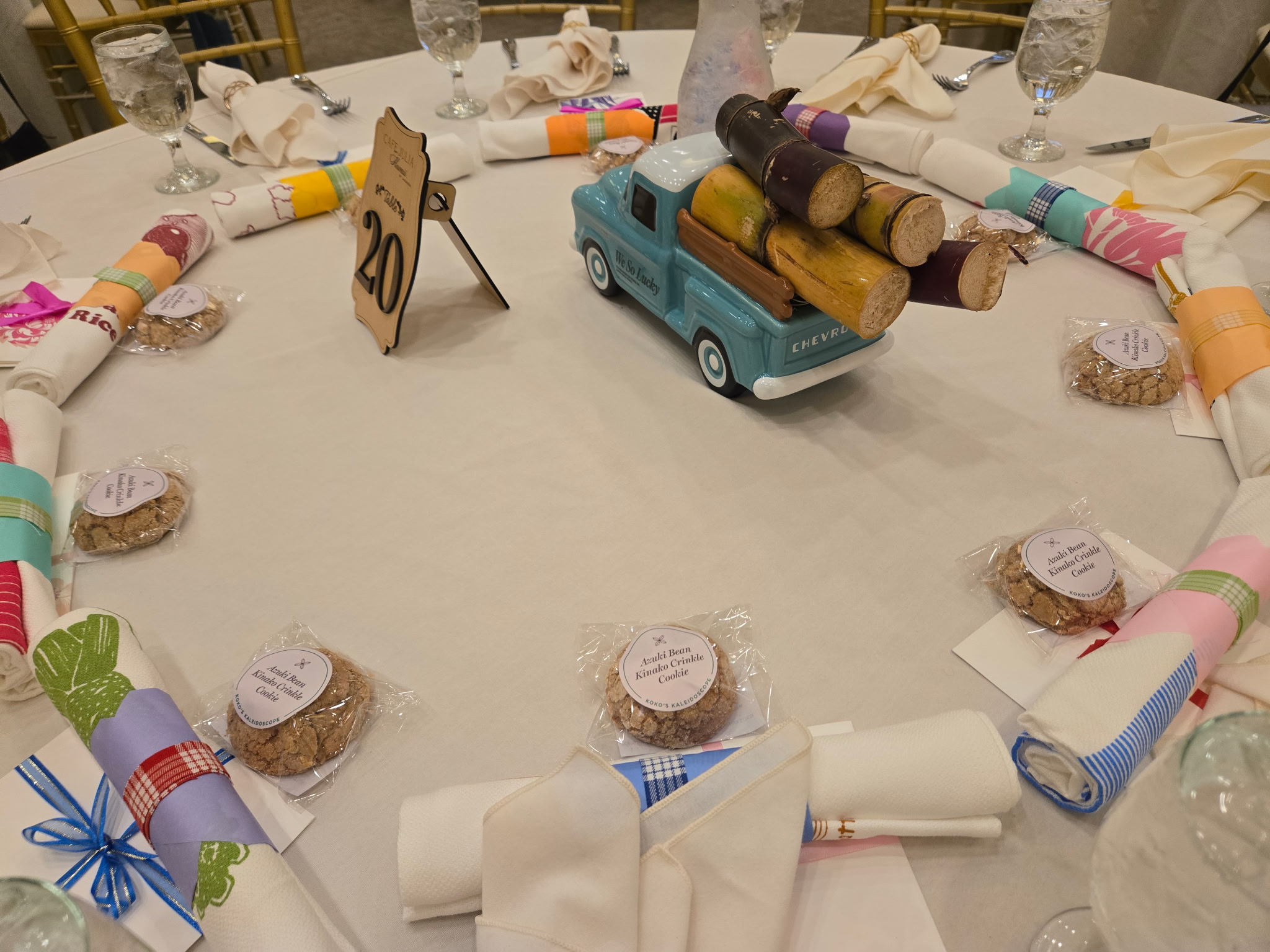 Individually wrapped Koko's Kaleidoscope cookies set at each place setting on a round event table